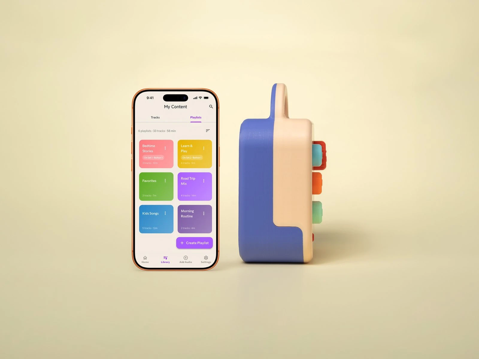 A Koobiba beside a phone showing the app that loads audio onto it